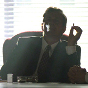 Smoking Man at his desk